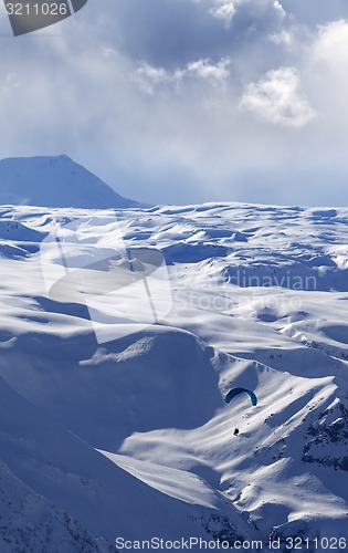 Image of Speed flying in winter evening mountains