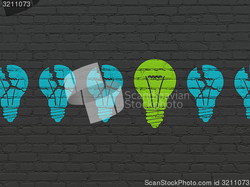 Image of Business concept: light bulb icon on wall background