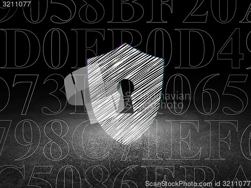 Image of Safety concept: Shield With Keyhole in grunge dark room