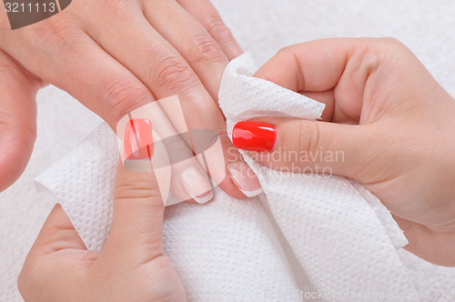 Image of manicure doing in beauty salon 