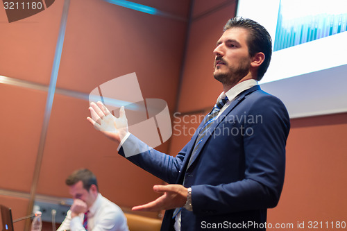 Image of Speaker giving talk at Business Conference.