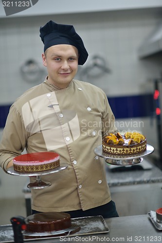 Image of chef preparing desert cake in the kitchen