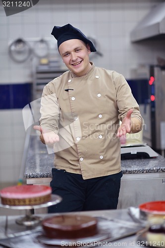 Image of chef preparing desert cake in the kitchen