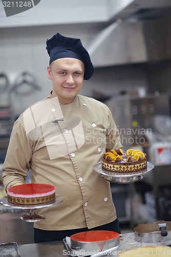 Image of chef preparing desert cake in the kitchen