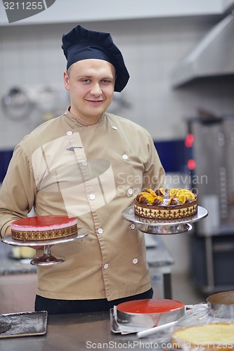 Image of chef preparing desert cake in the kitchen