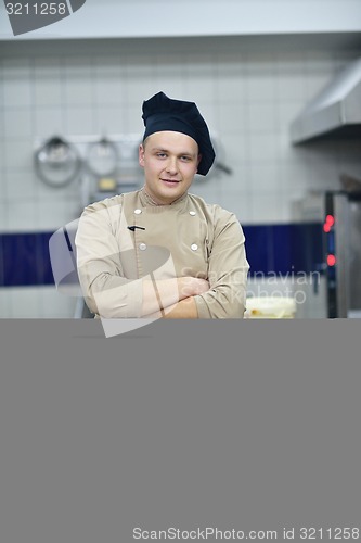 Image of chef preparing desert cake in the kitchen