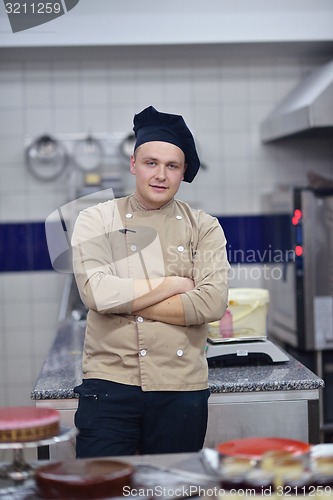 Image of chef preparing desert cake in the kitchen