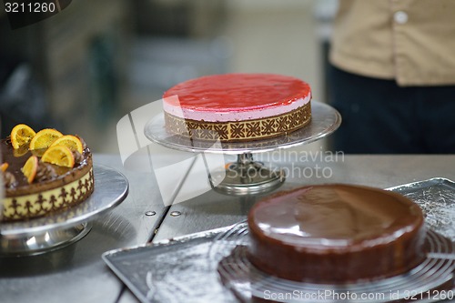 Image of chef preparing desert cake in the kitchen