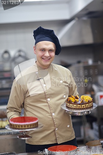 Image of chef preparing desert cake in the kitchen