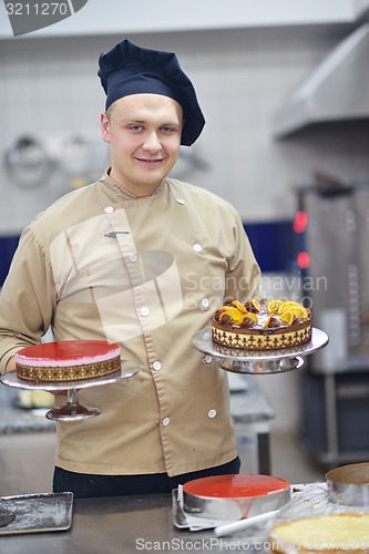 Image of chef preparing desert cake in the kitchen