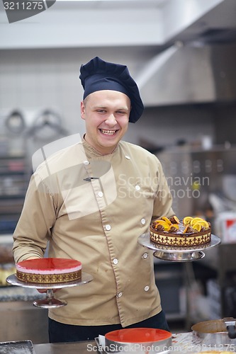 Image of chef preparing desert cake in the kitchen