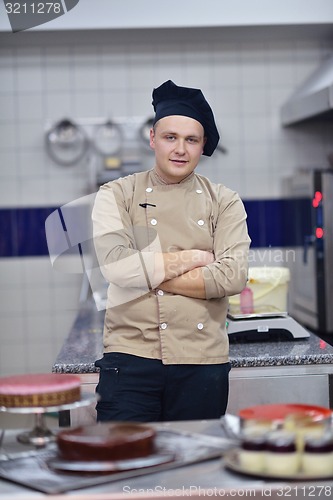 Image of chef preparing desert cake in the kitchen