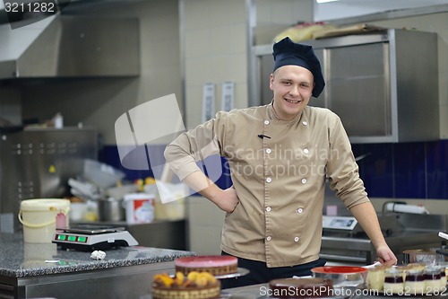 Image of chef preparing desert cake in the kitchen