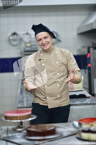 Image of chef preparing desert cake in the kitchen