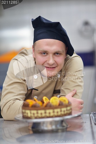 Image of chef preparing desert cake in the kitchen