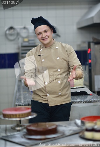 Image of chef preparing desert cake in the kitchen