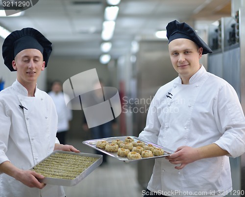 Image of chef preparing desert cake in the kitchen