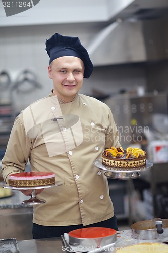 Image of chef preparing desert cake in the kitchen