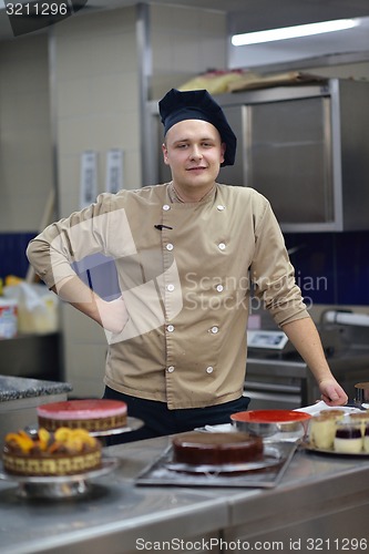 Image of chef preparing desert cake in the kitchen