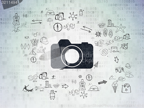 Image of Tourism concept: Photo Camera on Digital Paper background