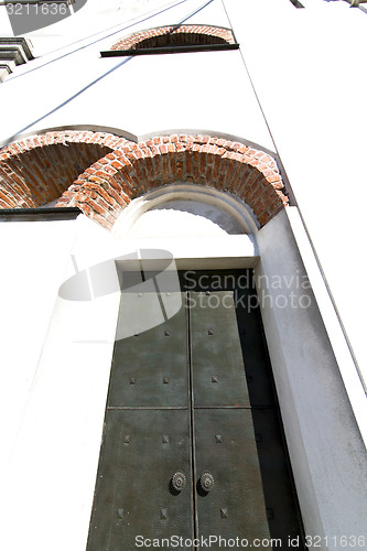 Image of caiello    knocker in a  door curch  closed wood italy  lombardy