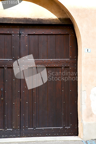 Image of  italy  lombardy     in  the milano old   church  door one