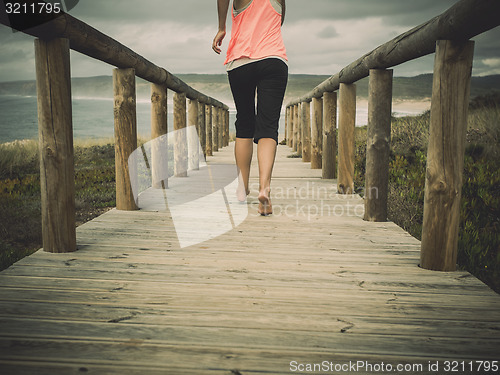 Image of Beautiful woman running