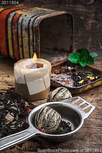 Image of tea brew with lime and mint on wooden background 