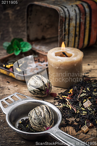 Image of tea brew with lime and mint on wooden background 