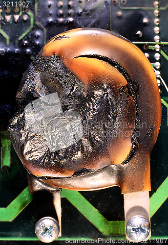 Image of MOV, Metal Oxide Varistor burnt by thunder and lightning.