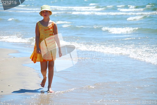 Image of Girl walk beach