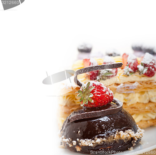 Image of selection of fresh cream cake dessert plate 