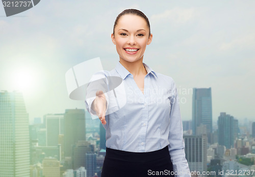 Image of businesswoman with opened hand ready for handshake