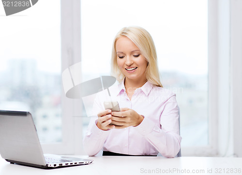 Image of smiling businesswoman or student with smartphone