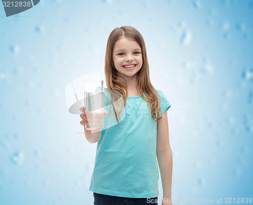 Image of smiling little girl giving glass of water