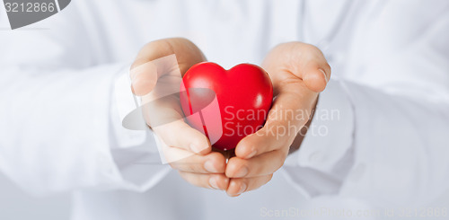 Image of man hands with heart
