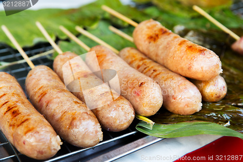 Image of grilled sausages at street market