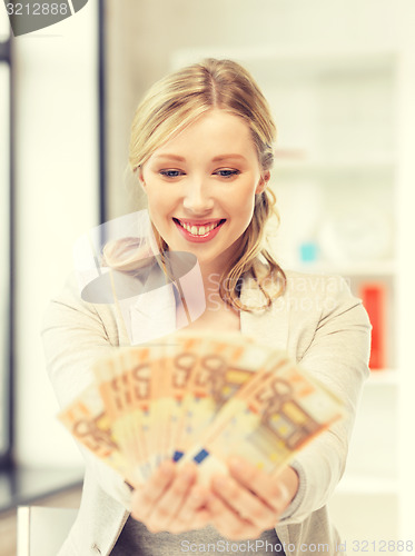 Image of lovely woman with euro cash money