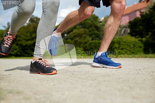 Image of close up of couple running outdoors