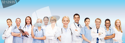 Image of smiling female doctors and nurses with stethoscope