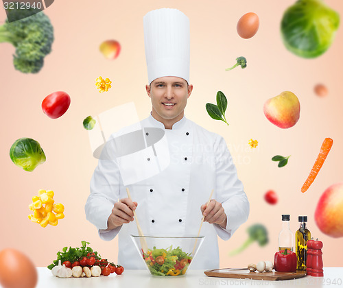 Image of happy male chef cook cooking food