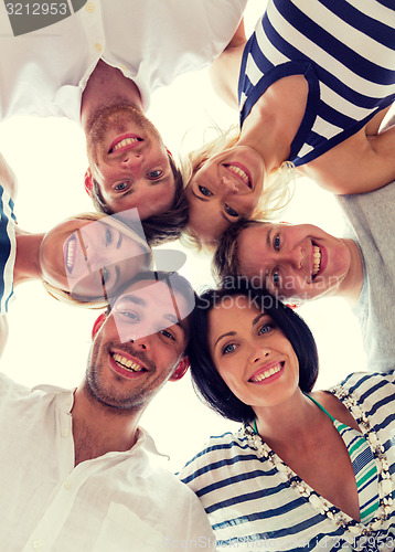 Image of smiling friends in circle