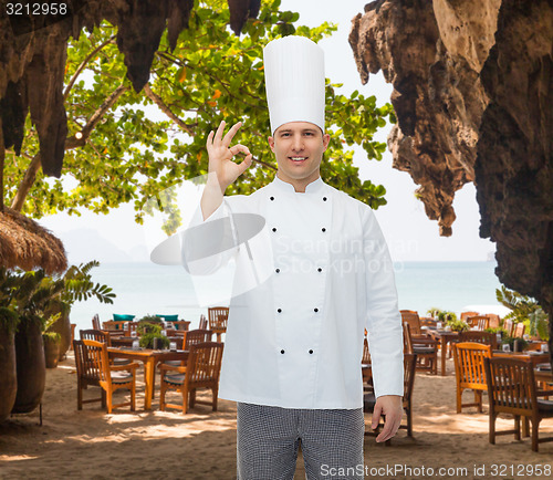 Image of happy male chef cook showing ok sign