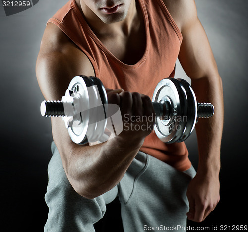 Image of young man with dumbbell