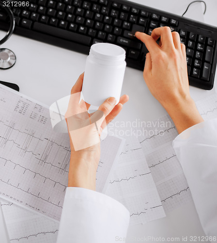 Image of doctor prescribing medication