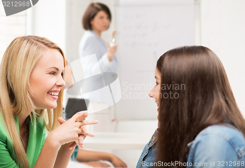 Image of student girls gossiping at school