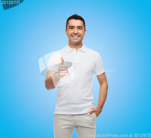Image of smiling man showing thumbs up