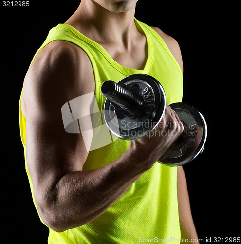 Image of young man with dumbbell