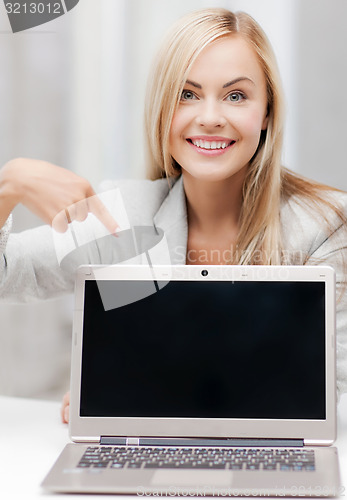 Image of businesswoman with laptop computer