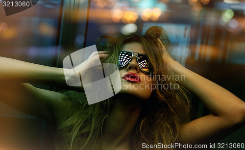 Image of fashionable woman in nightclub